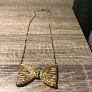 Gold bow tie pendant and chain